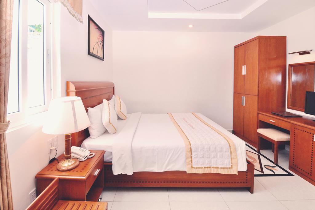 Tan Hoang Long Hotel TP. Hồ Chí Minh Phòng bức ảnh